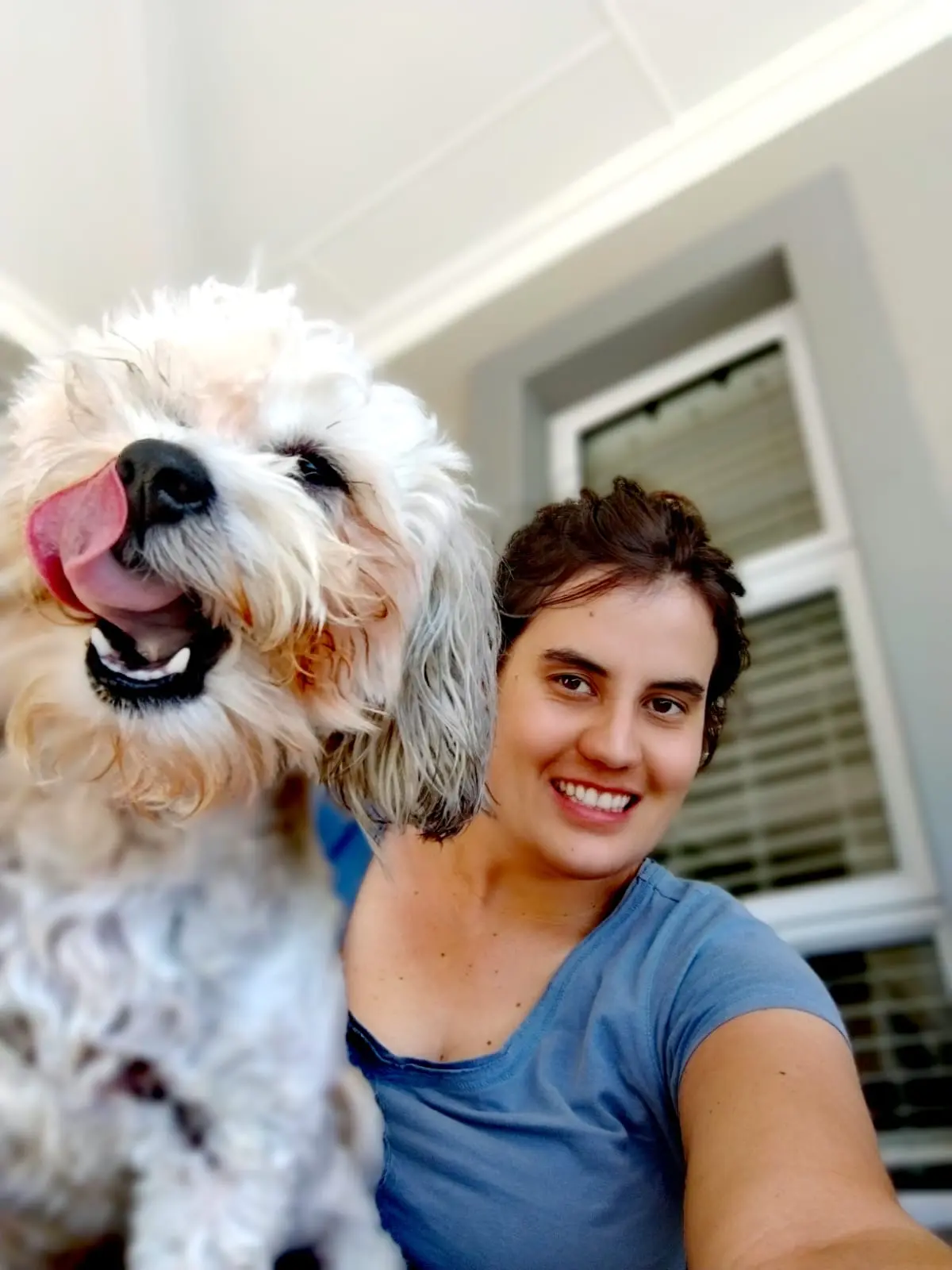 Mauruschka smiling with a happy dog